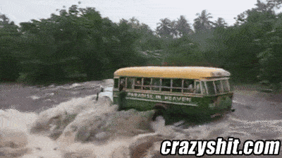 Bus Gets Swept Away In Flood