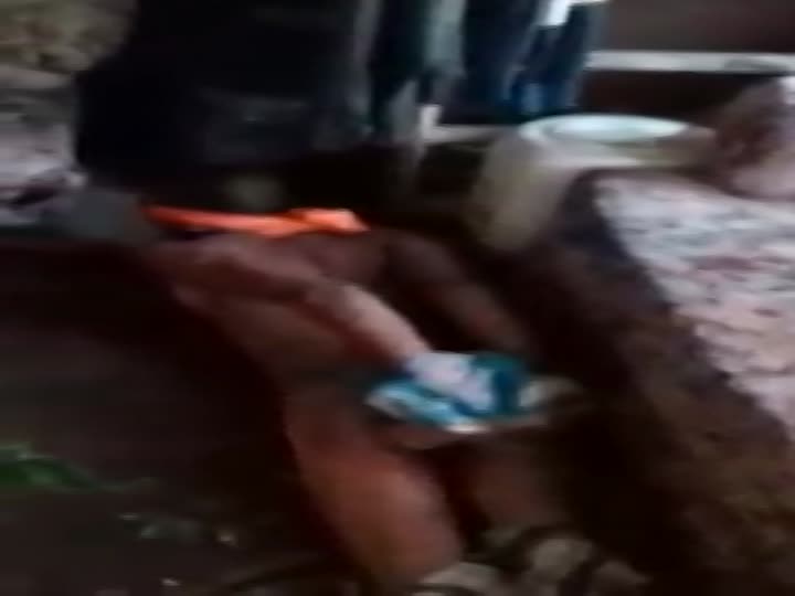 Blindfolded assnaked thief is tortured by villagers