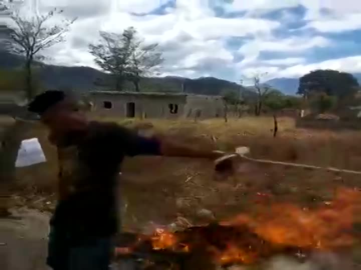 CrazyShit.com | Villagers torture property invader with fire - Crazy Shit