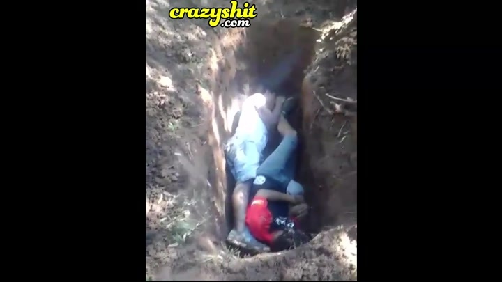 CrazyShit.com | Forced to dig own grave and executed, burned