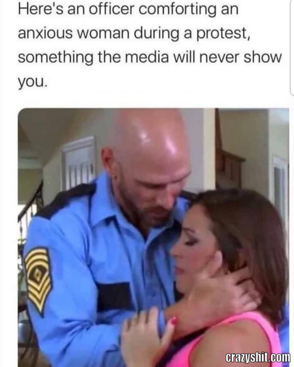 Officer Comforting An Anxious Woman