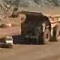 Mining truck flattens land rover