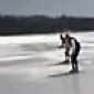 Jackass on snowmobile breaks through the ice