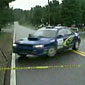 Rally car takes out cameraman