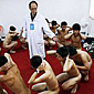 Doing the naked duck walk in an asian prison