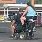 Fat people on a little scooter