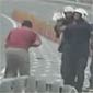 Bahraini Protester Meets Mr. Shotgun