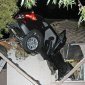 Car Crashes Through Roof