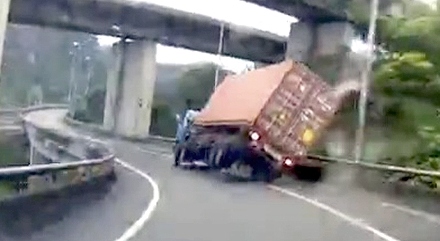 KISS HIM GOODBYE: TRUCK DRIVER GOES OVER THE EDGE
