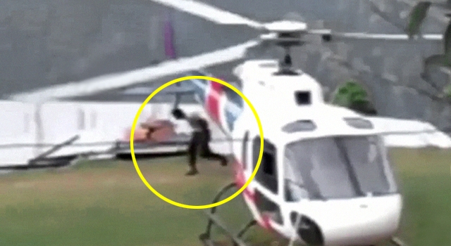 FUCKING HELL! GUY WALKS RIGHT INTO HELICOPTER ROTOR