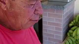 old man eating glass