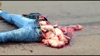 man has crushed body and ejected head