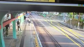 Woman randomly pushed on tracks
