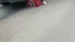 motorcyclist with leg stuck in truck