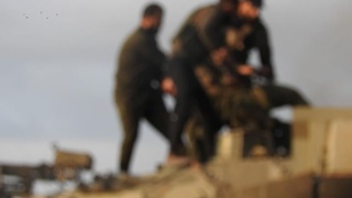 A number of soldiers were dragged from inside an Israeli Merkava tank