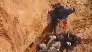 Sudanese burying civilians alive