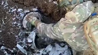 Ukrainian solider tries to wake up his friend