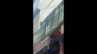Crowd Watches As Woman Roasts On Power Lines