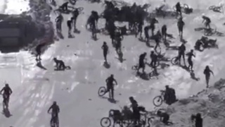 Cyclists on a ski slope