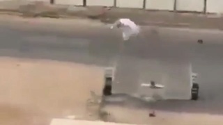 Riding his hoverboard..