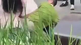 Man holding a woman hostage with scissors, gets bonked with a shovel