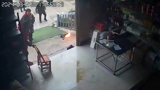 CHINESE WOMAN ALMOST BURNED BY FLAMED FRYING PAN