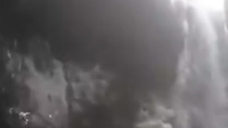 SKIER FALLS INTO SNOW COVERED WATERFALL