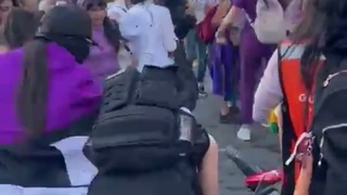 Guy gets beat up by girly protesters