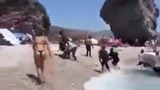 HORDES OF AFRICAN ILLEGAL INVADERS ARRIVE ON A TOPLESS BEACH IN SPAIN AMONG SHOCKED TOURISTS
