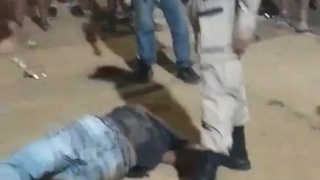 man is brutally kicked by a police officer