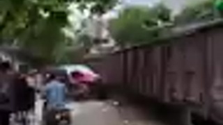 Man Tries to Stop Train from Hitting His Car