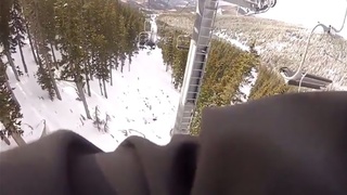 A guy falls from a ski-lift