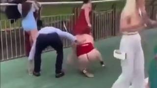 “Women” in fancy clothes fight