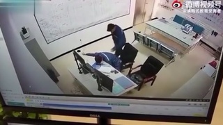 A man goes hammer time on a fellow worker