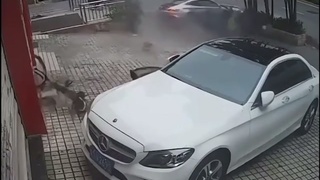 A sports car launches a bicyclist into a another sports car