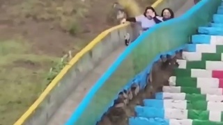 Women on slide eat dirt