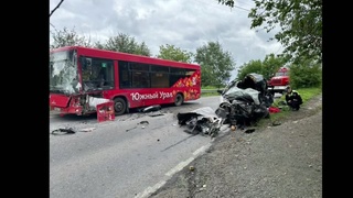 A car speeding around a corner hits a bus