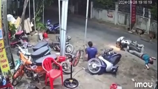 A dude on a scooter hits a dude almost on a scooter