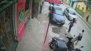 A woman is hit by a motorcycle