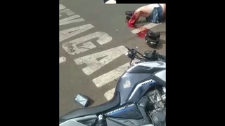 A motorcyclist hits the back of a car w/aftermath