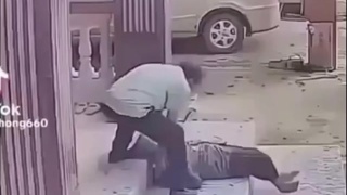 An old lady slips and cracks her head on the concrete step