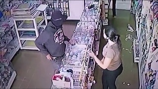 A woman working in a store is shot in the head