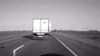 A passing truck hits a car head-on