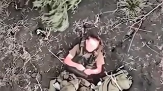 Injured Russian soldier throws drone grenade away