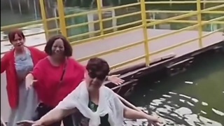 Three women on a bridge