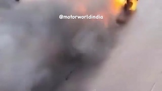 Burning driverless car chasing Indians