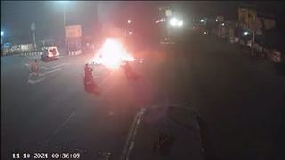 A motorcycle T-bones a car and explodes on impact