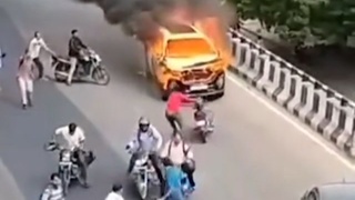 Burning car run on Bridge