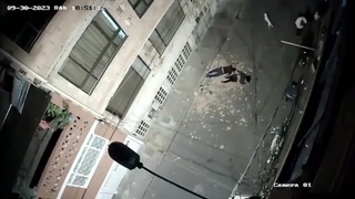 Two guys fighting on a fifth floor balcony fall