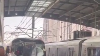 A train hits  a crane